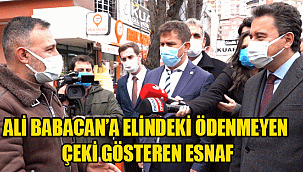 ALİ BABACAN’A ELİNDEKİ ÖDENMEYEN ÇEKİ GÖSTEREN ESNAF: